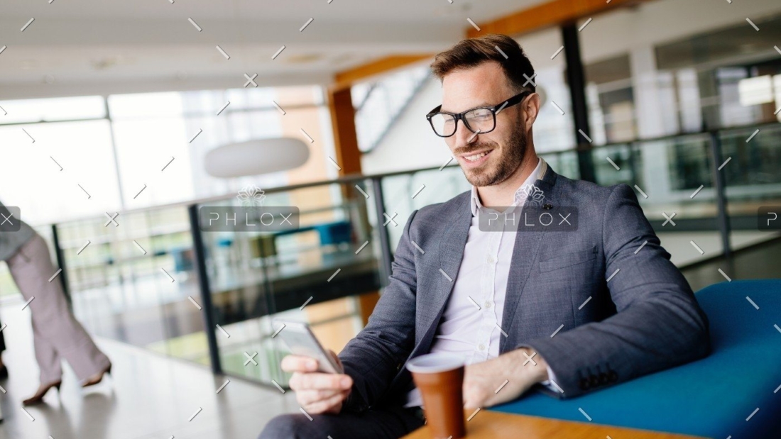 demo-attachment-657-businessman-taking-a-break-with-a-cup-of-coffee-JW4B3DH